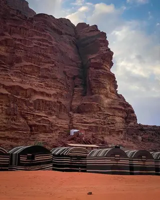 a group of domes in front of a mountain at Wadirum winter in Wadi Rum