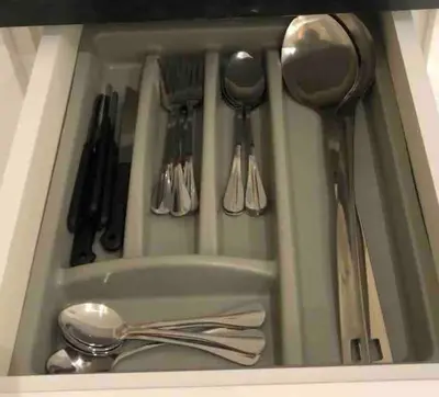 a drawer with spoons and utensils in it at Farmhouse with Pool and Breathtaking Views in Amman