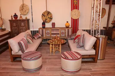 a living room with two couches and a table at Imagination Luxury Camp in Disah