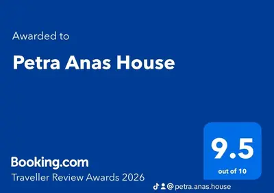 a blue sign with the words pta amas house at Petra Anas House in Wadi Musa