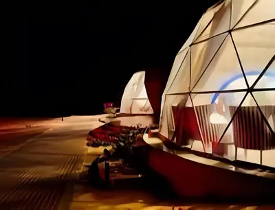 a group of boats parked on the beach at night at Shebara Camp Wadi Rum in Wadi Rum