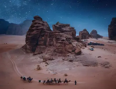 a group of people riding horses in the desert at Shebara Camp Wadi Rum in Wadi Rum