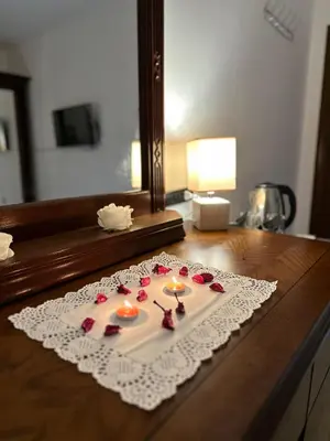 a table with candles on top of a table at Marvel Hotel Apartments in Wadi Musa