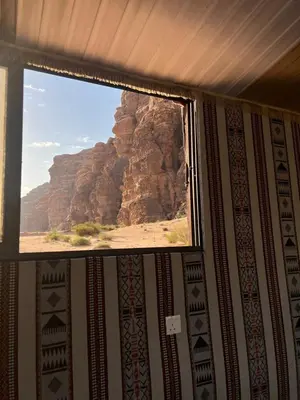 a window in a room with a view of a mountain at Mira Bedouin Camp in Wadi Rum