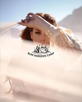 a woman in a white dress holding her veil at Rum Horizon Bubble luxury camp in Wadi Rum