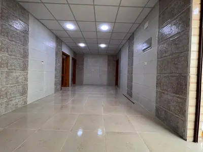 an empty hallway with tile walls and a ceiling at Wadi Rum Marina Camp in Wadi Rum