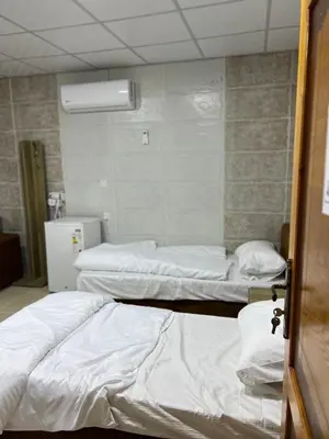 a hospital room with three beds in it at Wadi Rum Marina Camp in Wadi Rum