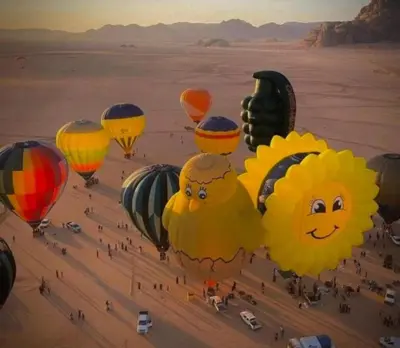 a group of hot air balloons in the desert at Joker camp Wadi Rum in Disah