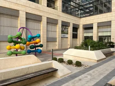 a sculpture in front of a building at DAMAC Luxury new 1 bedroom apartment in Amman