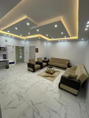 a large living room with couches and a table at Oskar Appartment in Wadi Musa
