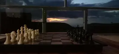 a chess board with chess pieces on a chessboard at Alnwatif Gate guest house Dana nature reserve in Dana