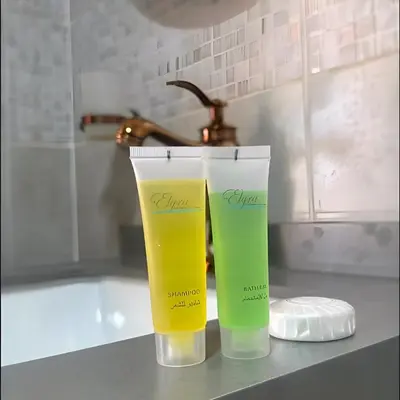 two bottles of sunscreen sitting on a bathroom counter at Charlotte luxury camp in Wadi Rum