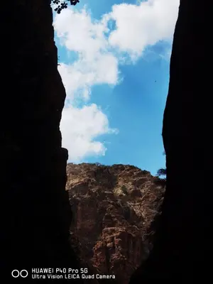 a view of a canyon from inside a cave at Wild Dana Eco Lodge- Hotel-Eco-Camp in Dana