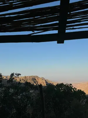 a view of the desert from a window at Wild Dana Eco Lodge- Hotel-Eco-Camp in Dana