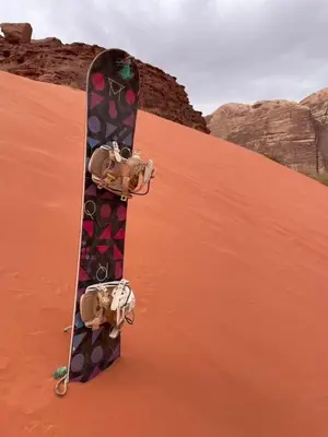 a skateboard sitting on top of a sand dune at Tamim Luxury wadi rum camp in Wadi Rum