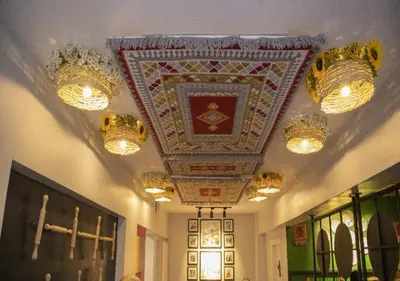 a room with a ceiling with chandeliers on it at Amman Trail Hotel & Studios in Amman