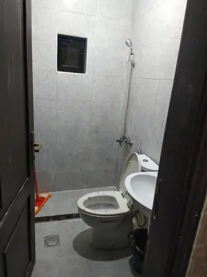 a bathroom with a toilet and a sink at شقة ام نوارة الحديثة modern nice flat in Amman