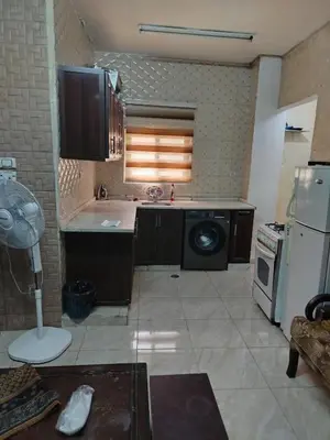 a kitchen with a stove and a dishwasher at شقة ام نوارة الحديثة modern nice flat in Amman