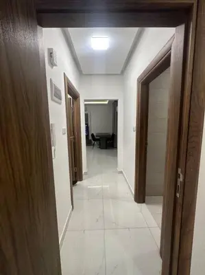 a hallway with a hallway leading to a room at cozy home near all services (22) in Rujm ash Sharāʼirah
