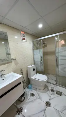 a bathroom with a toilet and a sink and a shower at Wadi rum camp in Wadi Rum