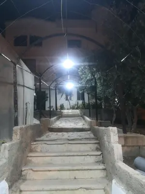 a group of stairs in a building at night at white tulips studio in Jerash