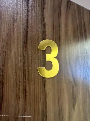 a yellow number on top of a wooden table at 3/ Antica jabalal-lwebdeh in Amman