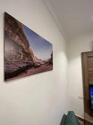 a painting hanging on a wall in a room at 3/ Antica jabalal-lwebdeh in Amman