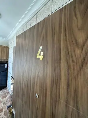 a large wooden door with the number forty on it at 4/ Antica jabalal-lwebdeh in Amman