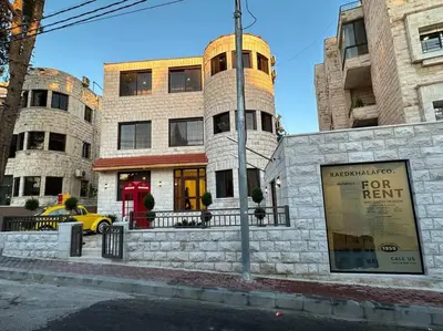 a building with a for rent sign in front of it at 6/ Antica jabalal-lwebdeh in Amman
