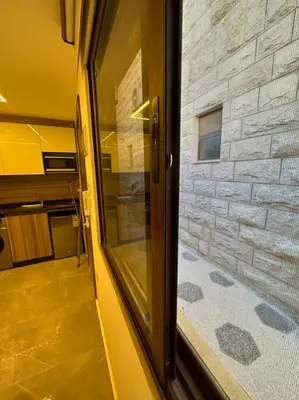 a glass door of a building with a window at XX/ Antica jabalal-lwebdeh in Amman