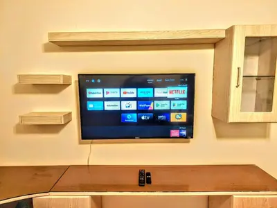 a flat screen tv hanging on a wall at Royal Luxury Amman Central Apartments in Amman