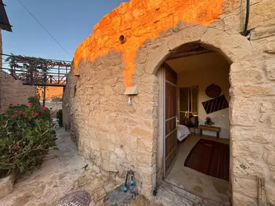 an entrance to a stone building with an archway at Dana Tower Hotel in Dana