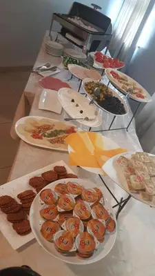 a table with many plates of food on it at Conord Hotel in Amman