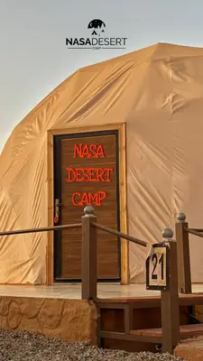 a sign in the door of a desert camp at Nasa desert luxury camp in Wadi Rum