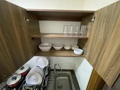 a small kitchen with a sink and some bowls at Apartment for rent 50M fully furnished - in Amman