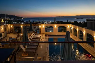 a view of the rooftop of a building with a swimming pool at My Hotel by Trend in Aqaba