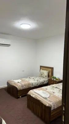 a room with two beds in a room with at Blue Bird House in Wadi Musa