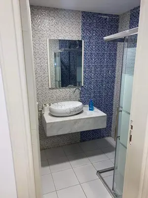 a bathroom with a sink and a mirror at The view in Amman