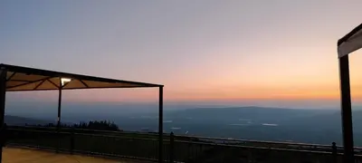 a view of the sunset from the top of a mountain at Magical Rosemary Chalet in Al Mashāriqah