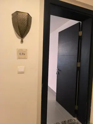a black door in a room with a sign on the wall at EP2 Samarah Resort in Sowayma