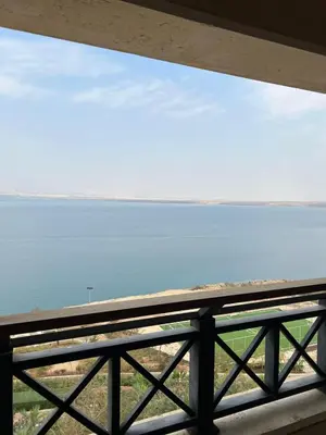 a view of the ocean from a balcony at E21 Samarah Resort Apartments in Sowayma