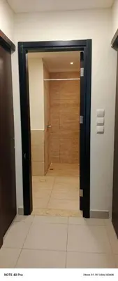 a door leading to a shower in a room at E13 Samarah Resort Apartment in Sowayma