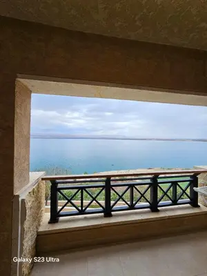 a view of the ocean from a window at E13 Samarah Resort Apartment in Sowayma