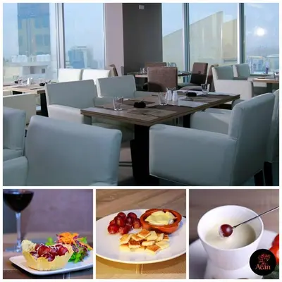a collage of pictures of a table with a plate of food at Prime Hotel in Amman