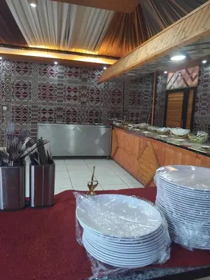 a restaurant with white plates on a table at Quite bubble tent in Wadi Rum