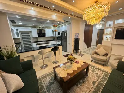 a living room with a couch and a table at شقق فندقية فاخرة in Amman