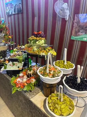 a buffet with many different types of food on a table at Magical desert camp in Disah