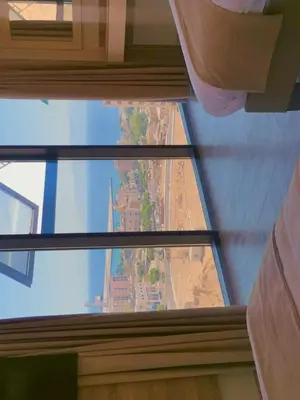 a view from the top of a glass window of a building at Alena Boutique Hotel in Aqaba