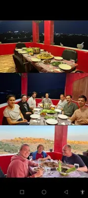 a group of people sitting at a table eating at Al-Bustan House& Umm Qais in Um Qeis
