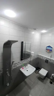 a bathroom with a sink and a toilet at Tala DeadSea Villa in Sowayma